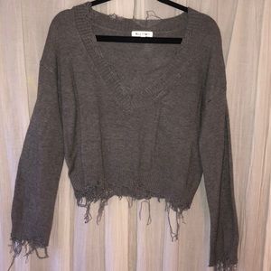 Distressed crop sweater